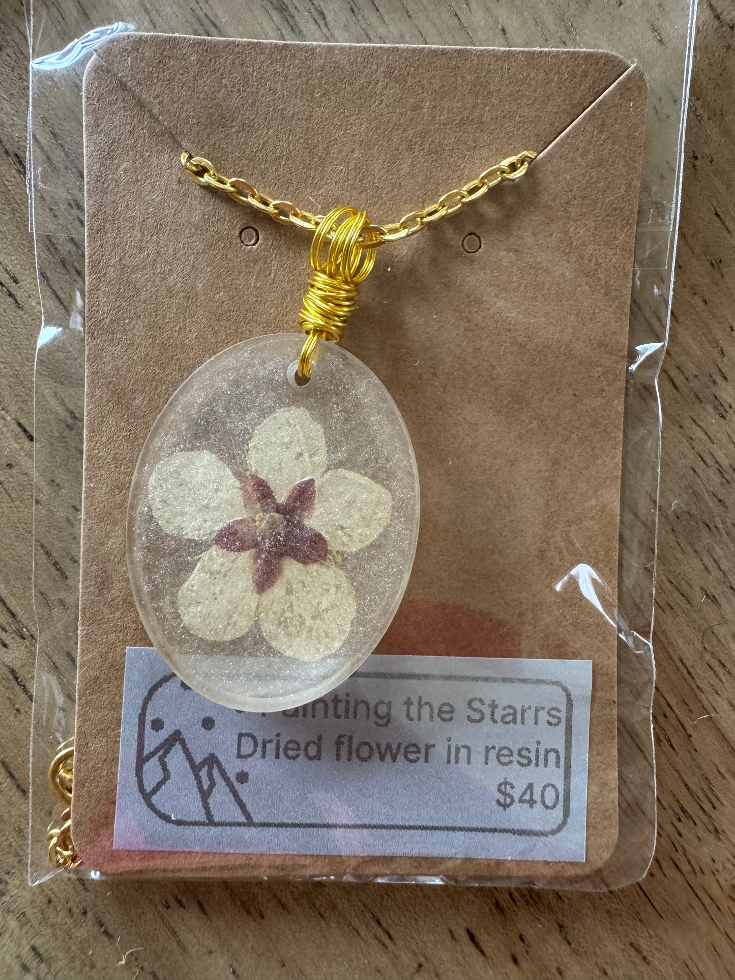 Large flower in oval shaped gold mica resin
