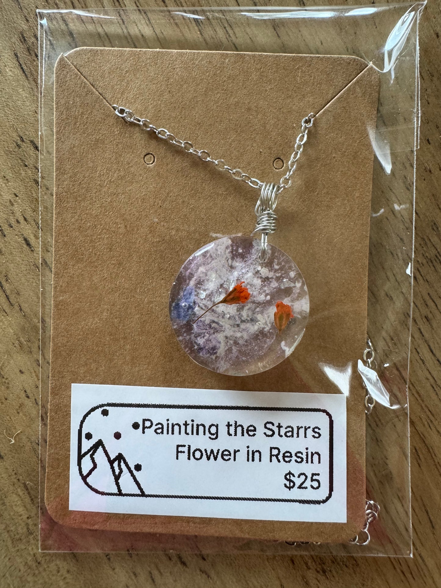 Purple and orange flowers in resin