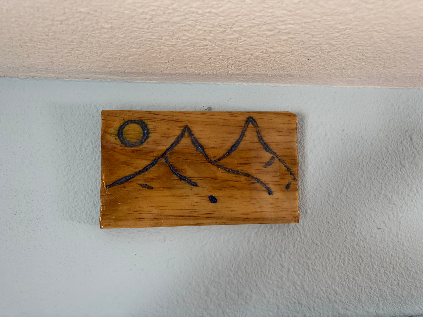 Engraved Mountains filled with blue resin on wood panel (version 2)