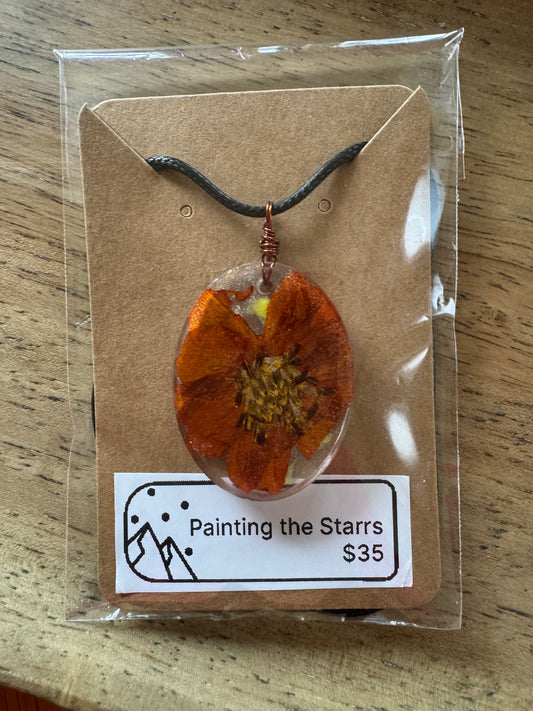 Burnt orange flower in resin