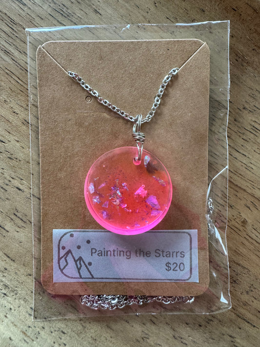 Bright pink resin circle with metal flecks