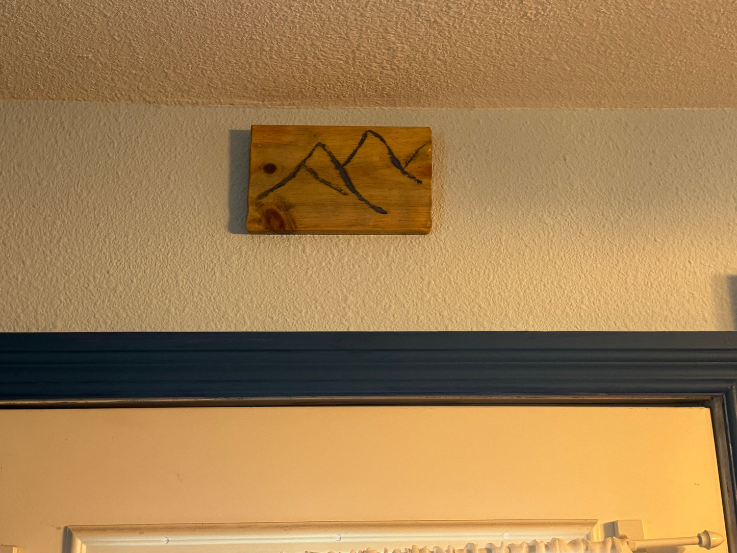 Engraved Mountains filled with blue resin on wood panel  (version 1)