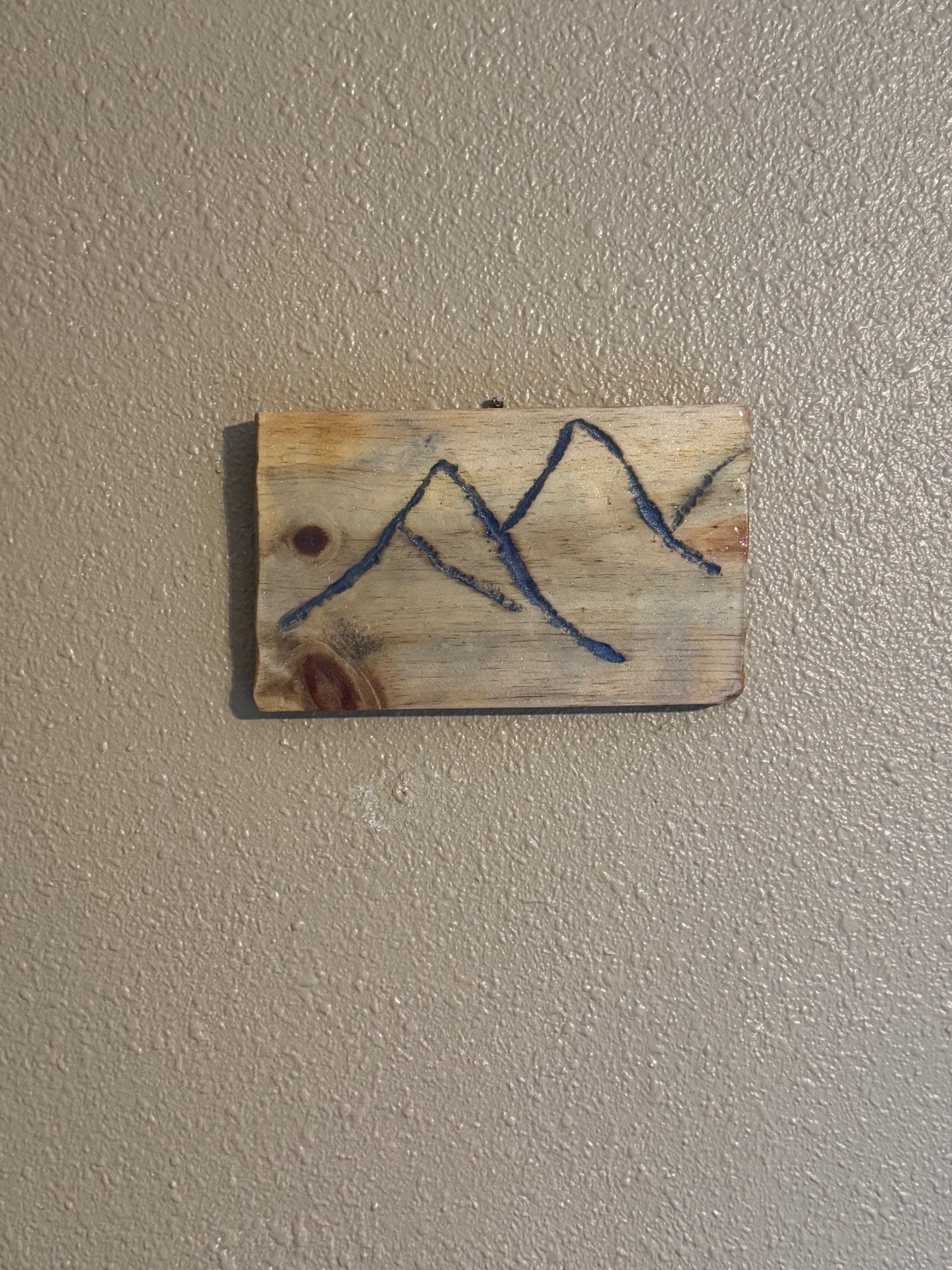 Engraved Mountains filled with blue resin on wood panel  (version 1)